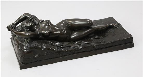 Manner of Claude Michel Clodion. A large bronze of a classical woman reclining upon a cloak and vines, W.2ft 9in. H.10in.